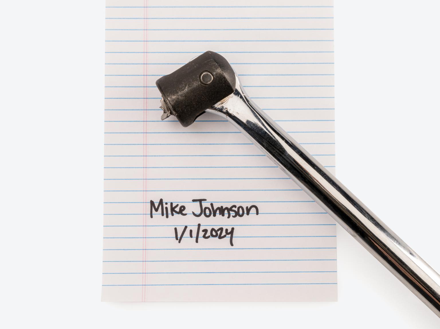 Warrantied Tekton tool on paper with name and date